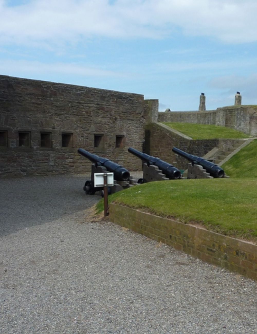 Victorian cannon lined up in the castle courtyard